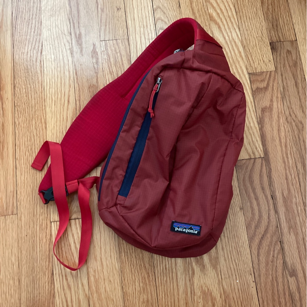 In excellent condition Patagonia sling bag red